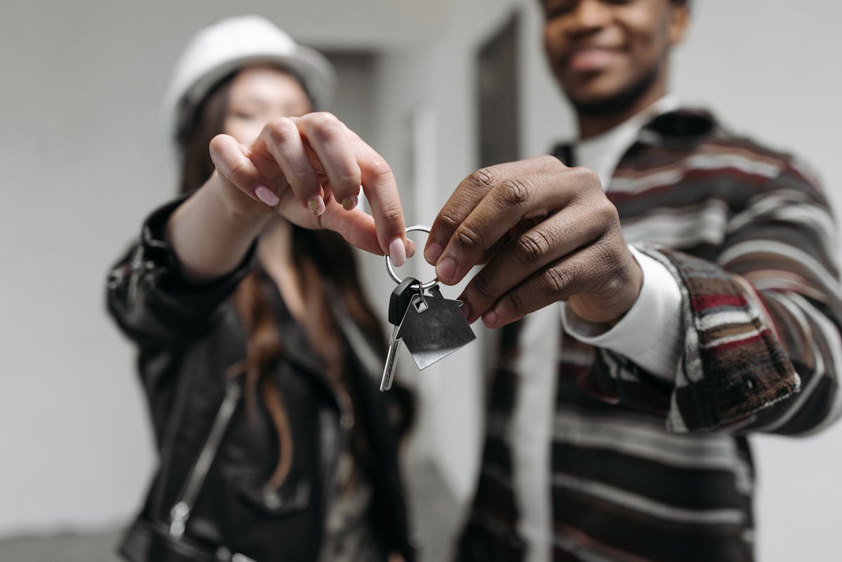 Couple receiving keys at closing